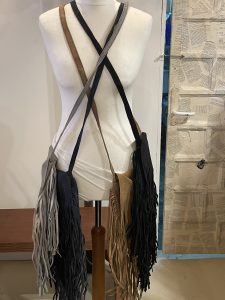 Suede tassle bags long stripe and no zip inside. Comes in different colors